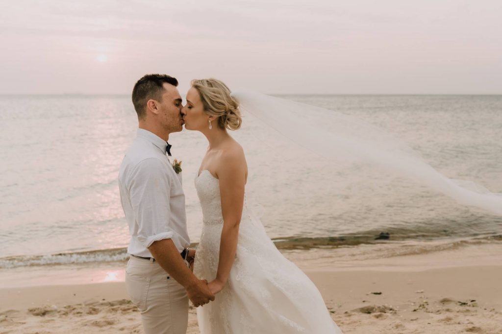 beach wedding kiss